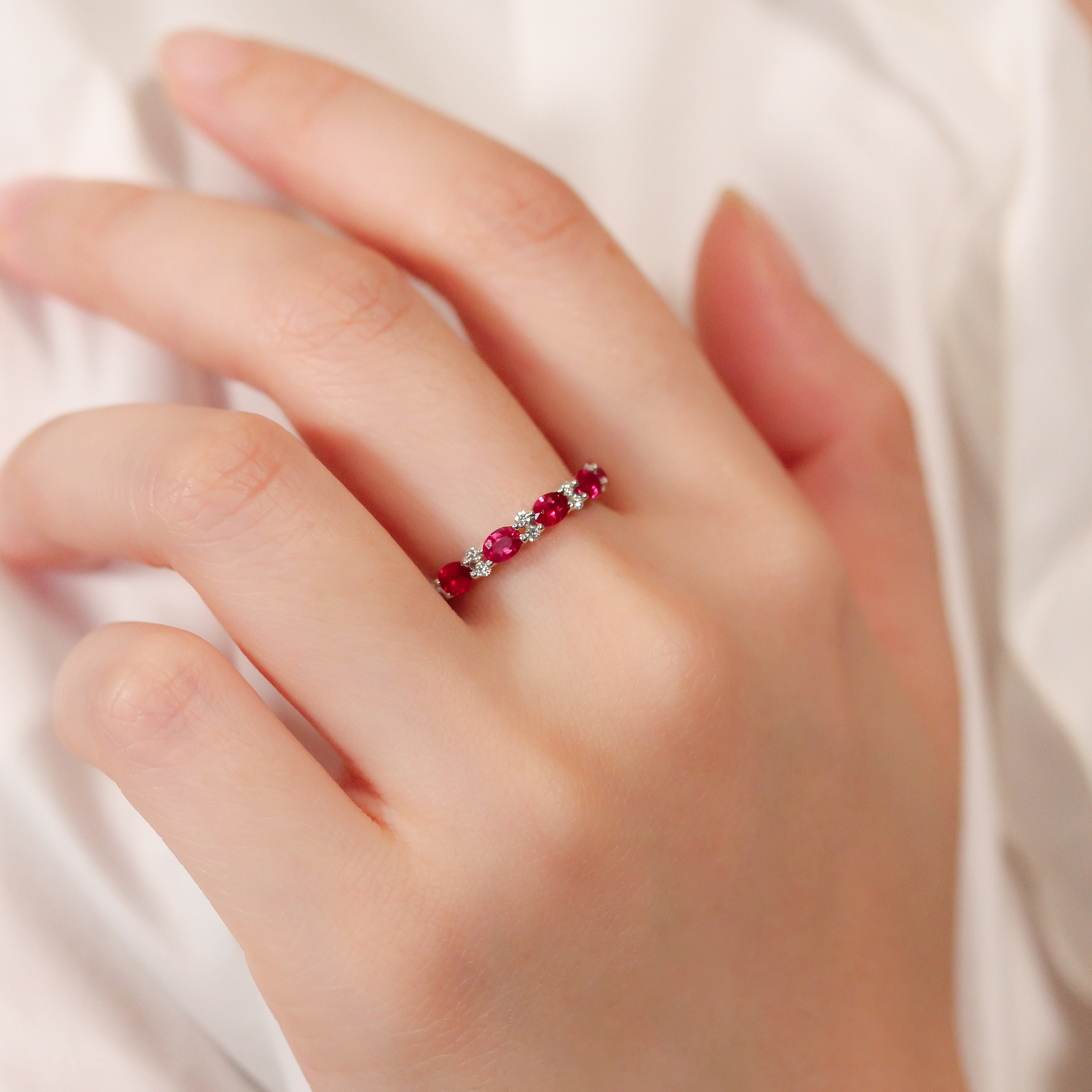Oval ruby diamond band